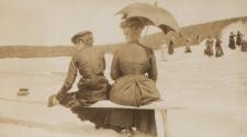 Mary Mulligan and Adelaide Hubbell viewing Yellowstone geyser from bench, Western Trip