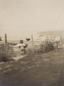 Man on child overlooking water, Western Trip
