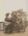 Mary Mulligan talking to two unidentified men, Western Trip