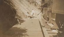 Woman beside train, Western Trip