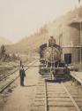 Man beside stopped train, Western Trip