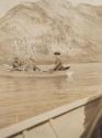 Hubbells being rowed in boat, Western Trip
