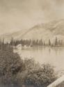 View of lake, cabin and mountains, Western Trip