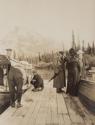 George Eastman and companions on deck beside boat, Western Trip
