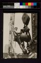 [Man on hoisting ball, Empire State Building]