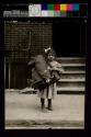 Child taking home work to be done, about 1908