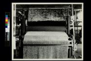 Rolling imitation astrukham (?) finish into cloth. (Shelton Looms)