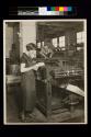A courier in a modern printing shop.