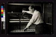[Young man tuning a piano]
