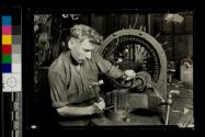 [Man repairing electric motor]