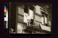 [Boy on window ledge]
