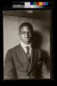 [Man in stiff collar and suit coat]