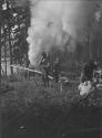 Camp Workers beside Fire, George Eastman's Nipigon Trip