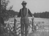 Camping Companion Displaying Fish, George Eastman's Nipigon Trip