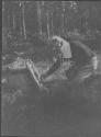Camping Companion viewing Mounted Fish, George Eastman's Nipigon Trip