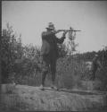 Camping Companion with Rifle, George Eastman's Nipigon Trip