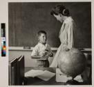 [Boy giving Valentine to teacher]