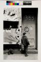 Boy with store mural