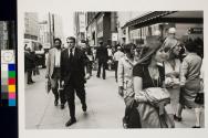 Businessmen and window shoppers