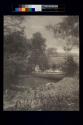 [Man fishing from boat]