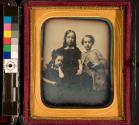 [Three children posing in studio]