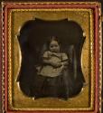 [Girl with bracelet in chair]