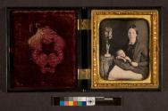 [Woman holding baby (possibly postmortem)]