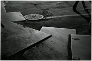 [Steel plates and manhole cover on the road]
