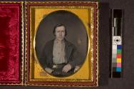 [Portrait of a man wearing belt with large buckle, probably a gold miner]