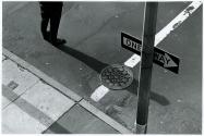 [Man standing in one way street]