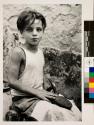 [Boy repairing a shoe]