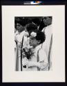 [Choir boy with carnations]