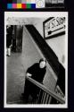 [Woman waiting on subway platform]