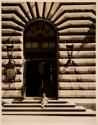 [Child sitting on step of New York Public Library]