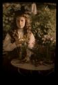 [Katherine Stieglitz with vase of flowers]