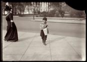 Newsboy and Woman