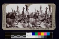 French graves smashed by German shell fire; a German sniper was discovered hidden in a coffin