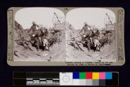 Tenderly carrying a "blighty" case to an aid post through the maze of trenches at Passachendaele