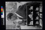 All the paraphernalia of the tourist traffic are evident around Cologne cathedral, such as this man who sells small silver replicas of the cathedral.