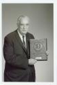 Harris Tuttle displaying his Police Photographer's Award
