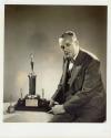 Harris Tuttle with trophy for Best Home Movie Sales Service