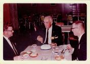 Harris Tuttle cutting cake