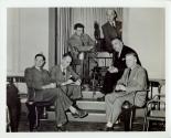 Harris Tuttle and colleagues seated beside projector
