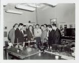 Men examining cameras