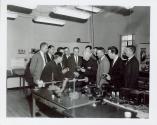 Harris Tuttle showing camera to large group