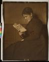 [Woman reading]