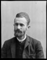 George Eastman with pearl stickpin, dark suit, tie