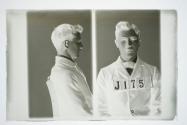 [James Foley, police booking photograph (profile and full face)]