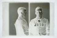 [Ed. Wheeler, police booking photograph (profile and full face)]