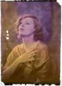 [Woman in gold wrap]